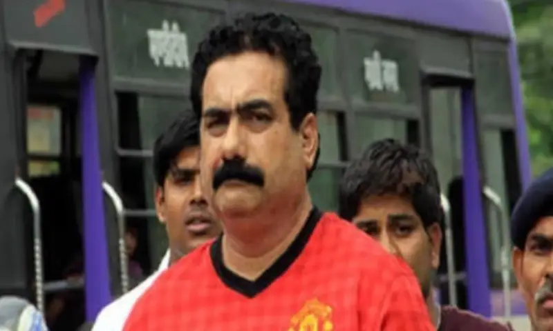 Mukhtar malik in orange shirt
